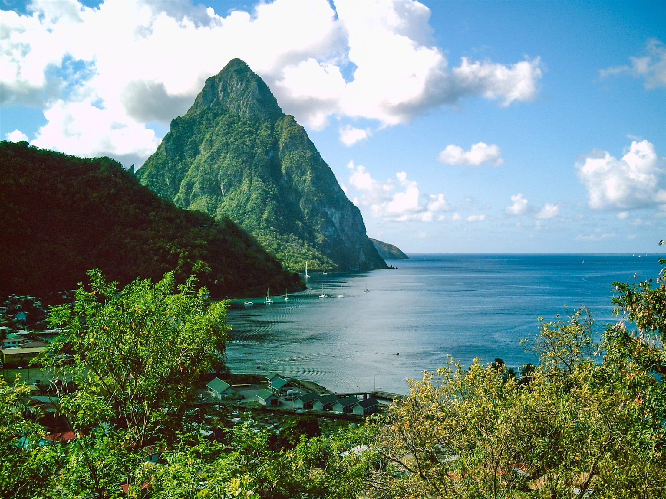View of the Petit Piton rising above the Caribbean coastline in Saint Lucia.